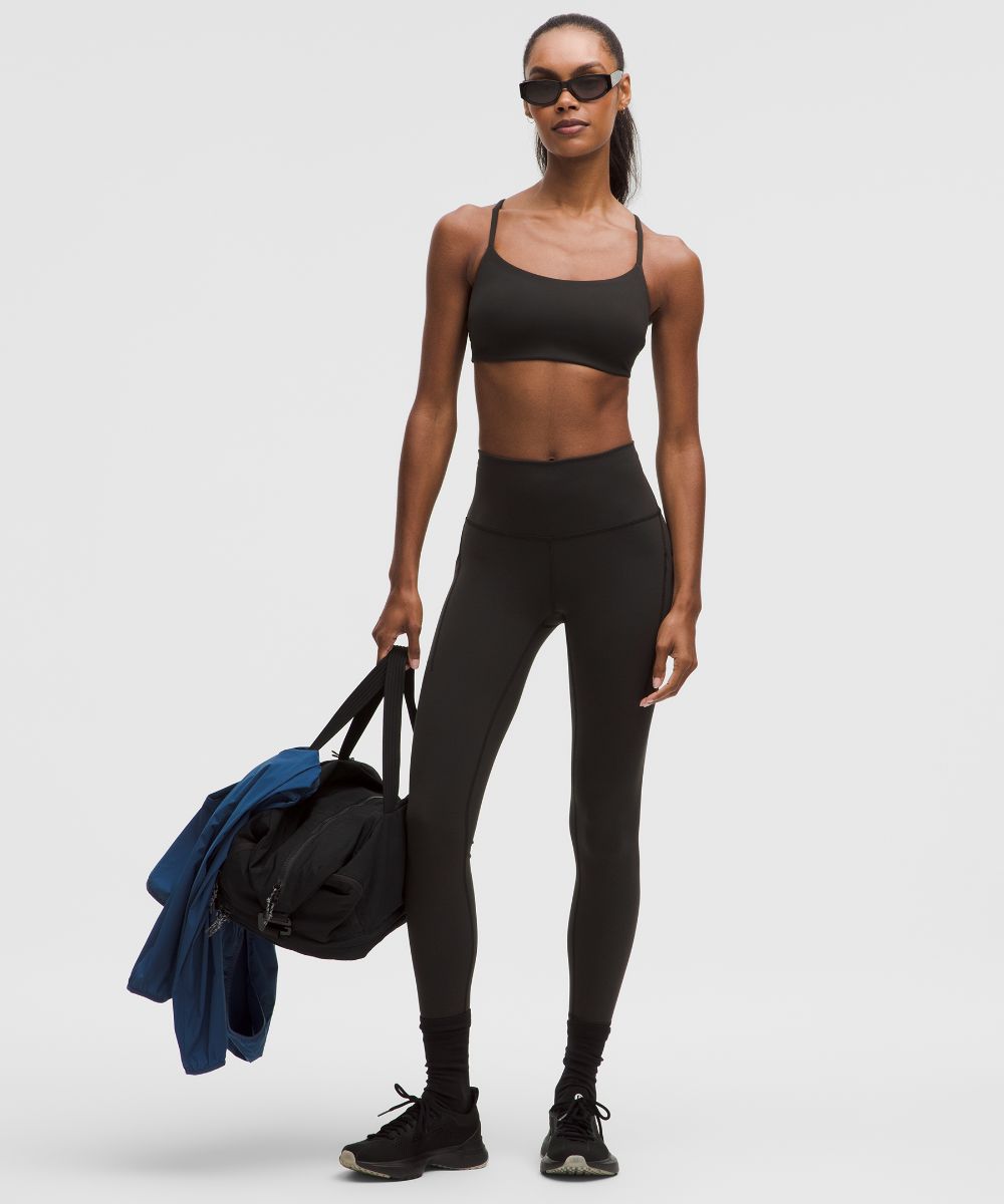 Legging Wunder Train taille haute avec poches 64 cm